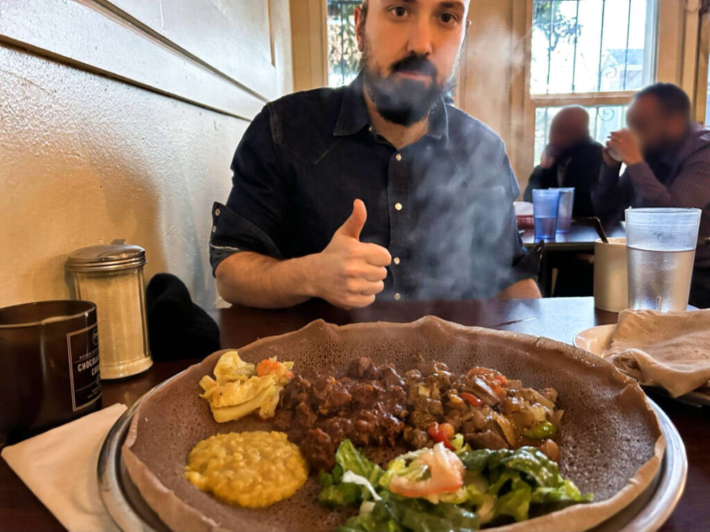 View of the smoking food in front of the author's husband