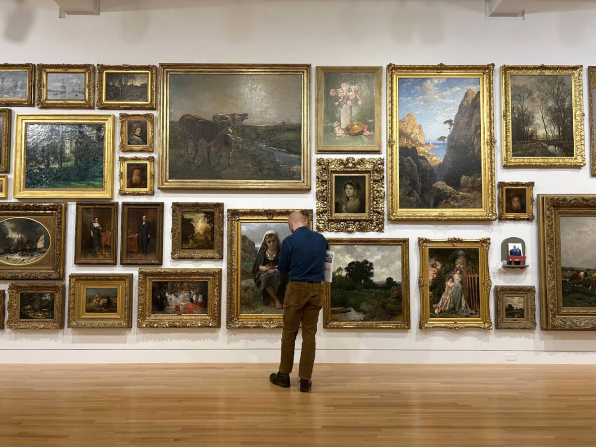 The author's husband checking out the paintings at Frye Art Museum