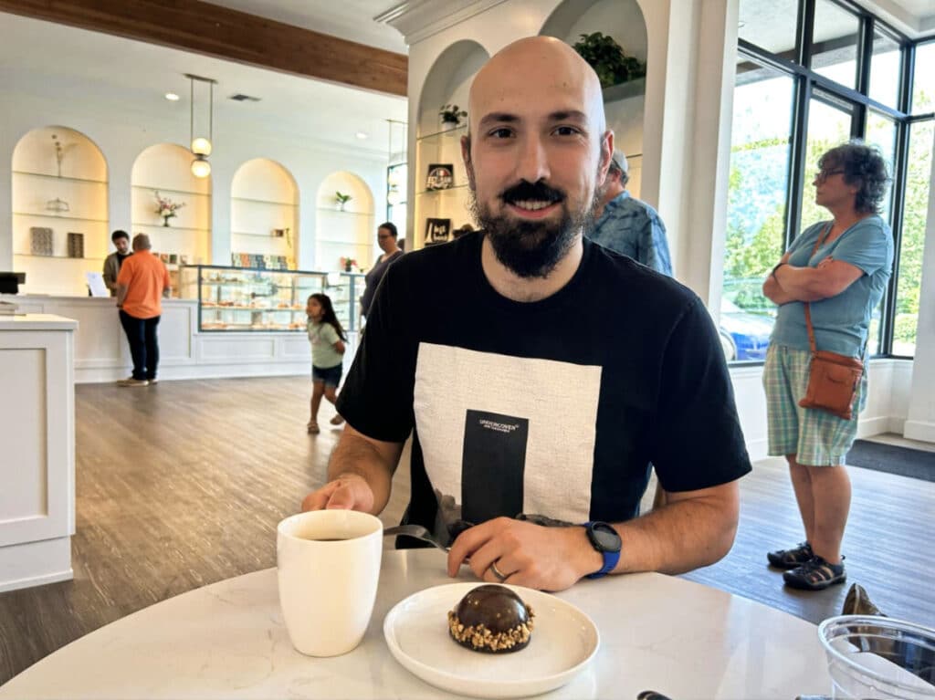 The author Chelsea Booker's husband at the Left Bank Pastry
