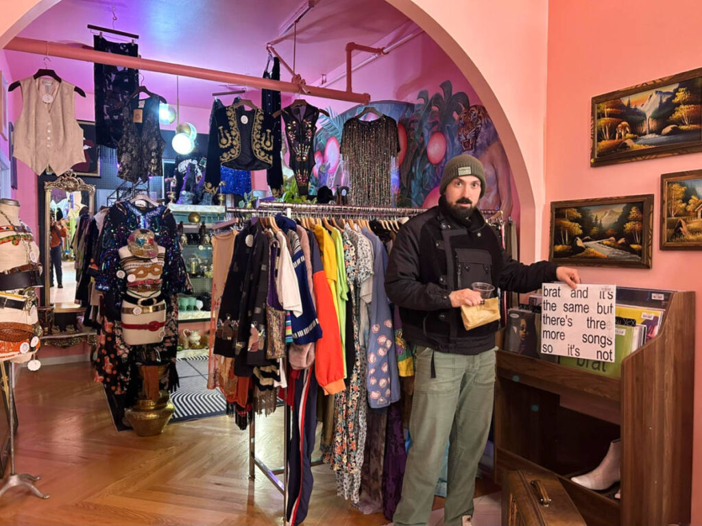 The author's husband looking at the vinyl records in Cher Baby Vintage