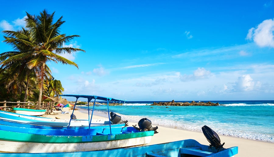 View of boats by the beach in Chen Rio