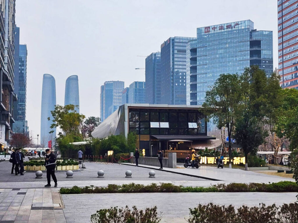 View of the people wandering around Chengdu’s Financial District with skyline views of Chengdu in the background
