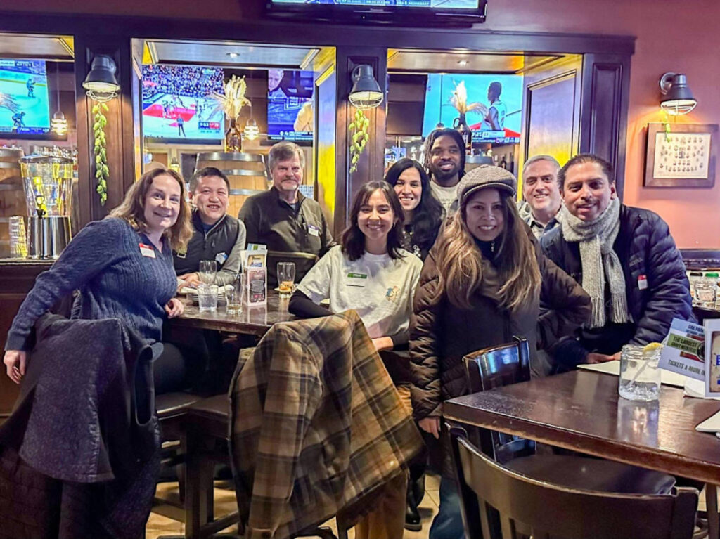 People smiling for a photo during the Travel Lemming's Chicago Community Meetups