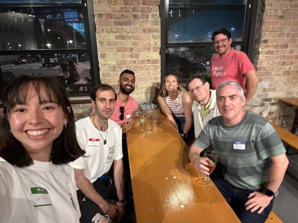 People smiling for a photo during the Travel Lemming's Chicago Community Meetups
