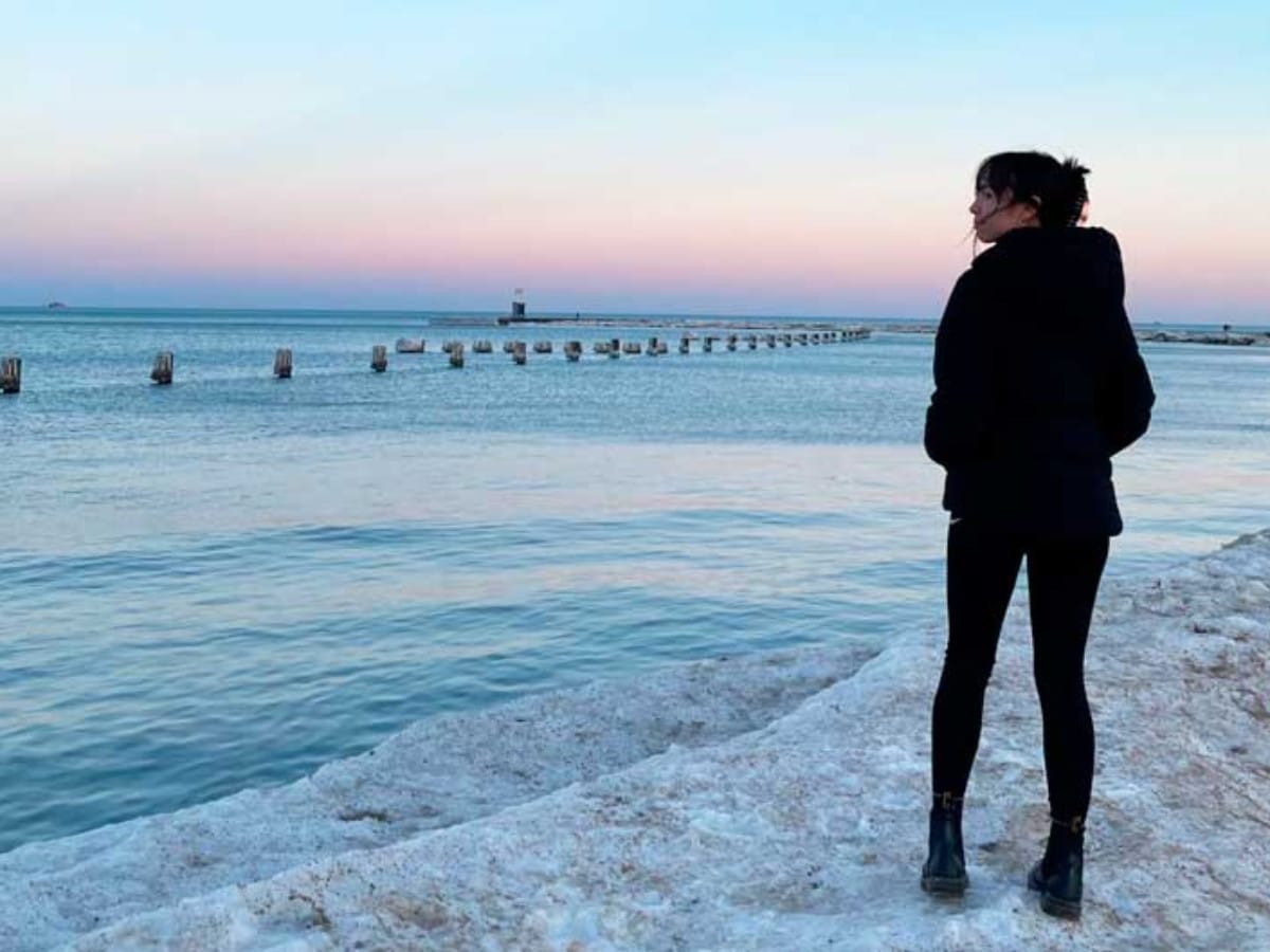 The author, Lea Rose Allbaugh wearing a puffer jacket during winter season in Chicago