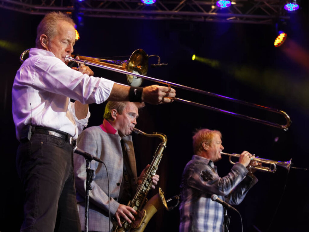 A group performing their instruments at the Chicago Jazz Festival
