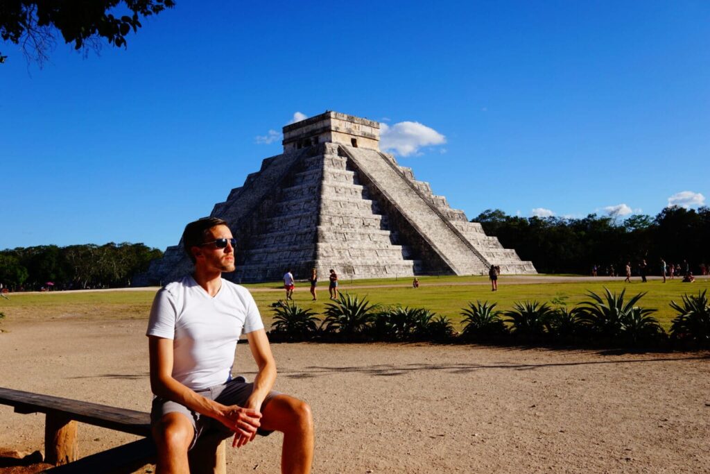 Nate sitting in front of the Chichen Itza Mayan ruins