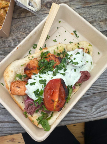 A plate of grilled chicken kebab from Gosht