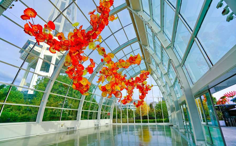 Flowers hanging on a glass architecture in Chihuly Garden and Glass
