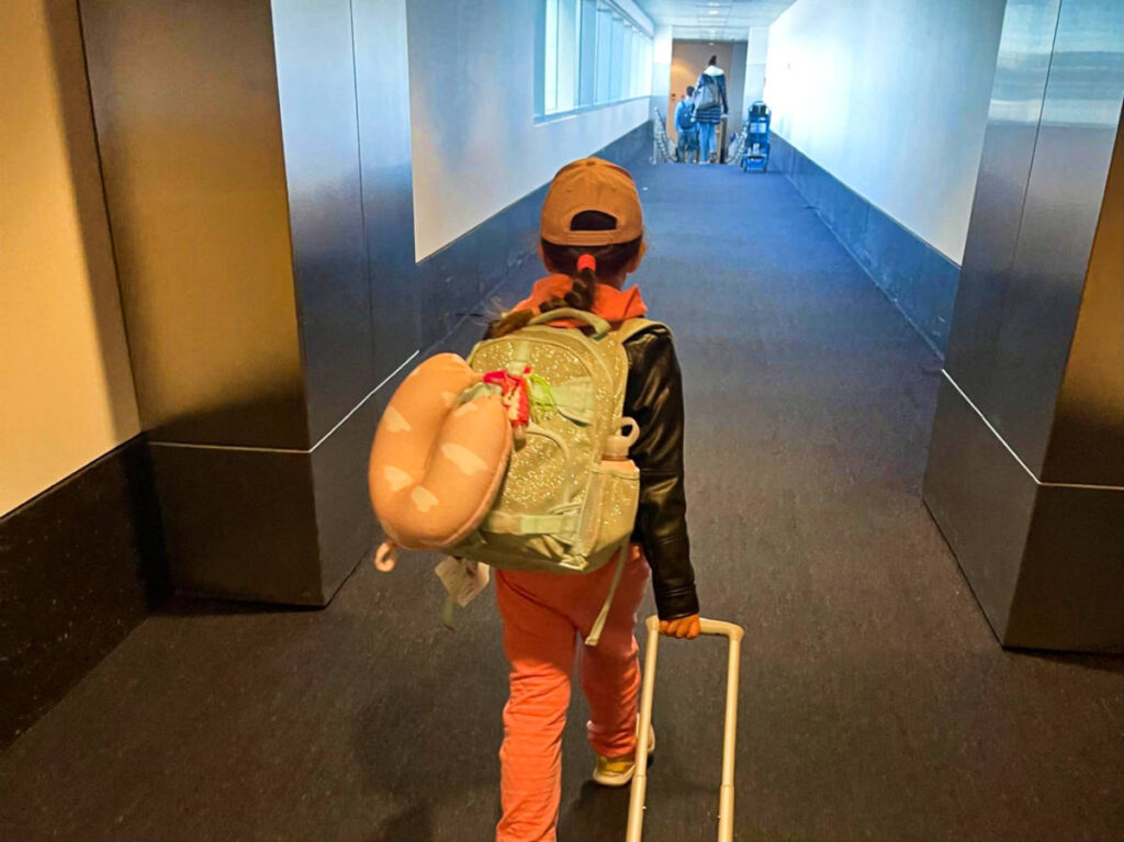 A child leading down to the departing gate