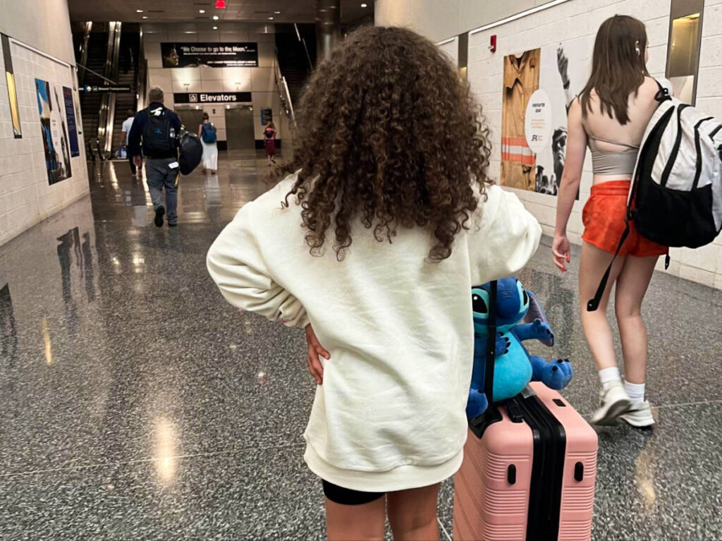 The author's daughter navigating around the airport