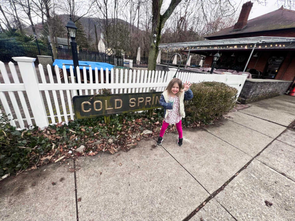 A child enjoying at the Cold Spring village on a gloomy day