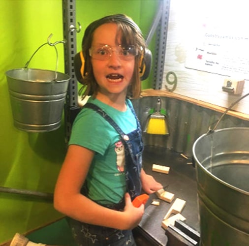 The author's daughter having fun playing in Children’s Museum of Denver