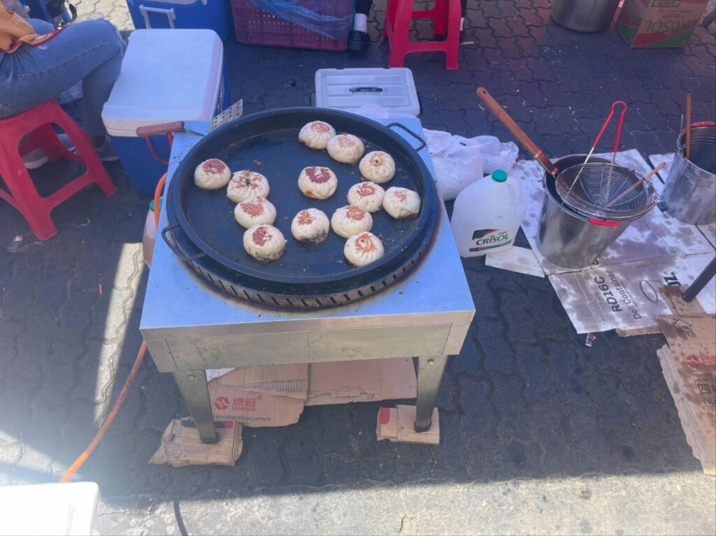 Chinese bao buns being cooked on a street market