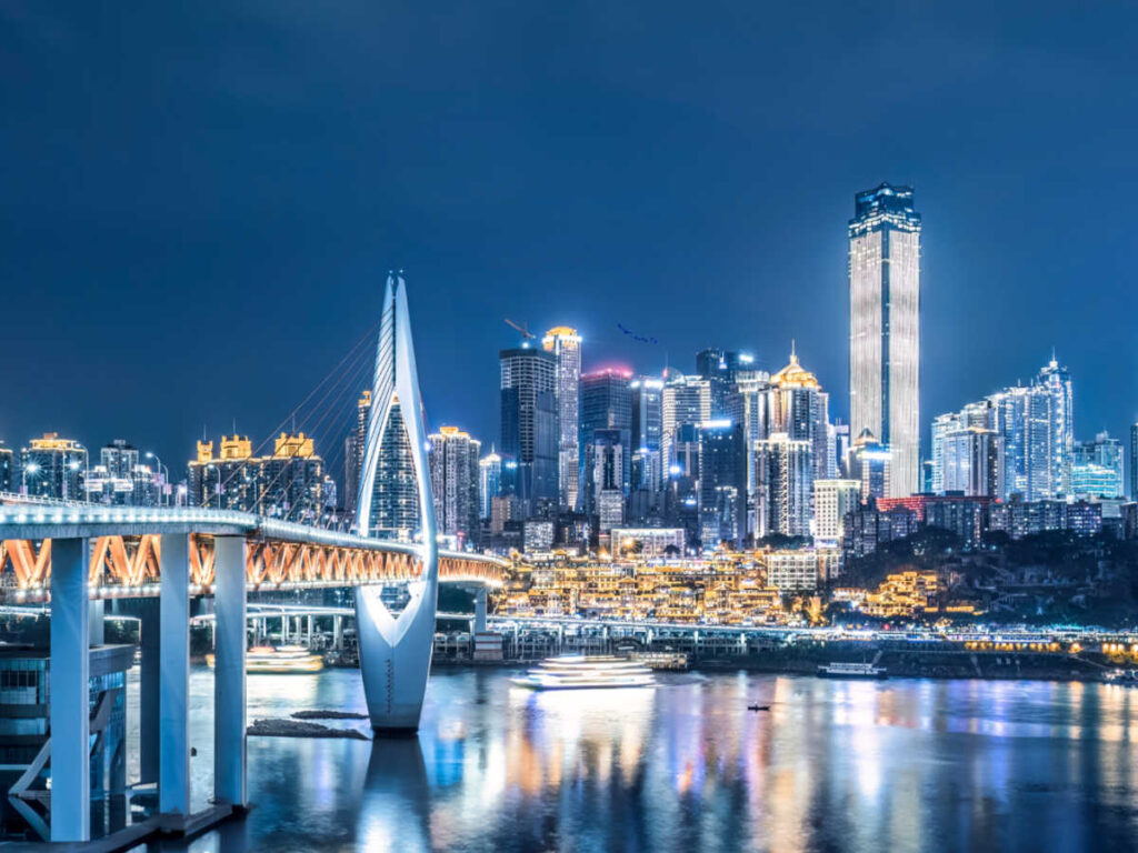 Panoramic view of the bridge and the skyline of Chongqing illuminated at night