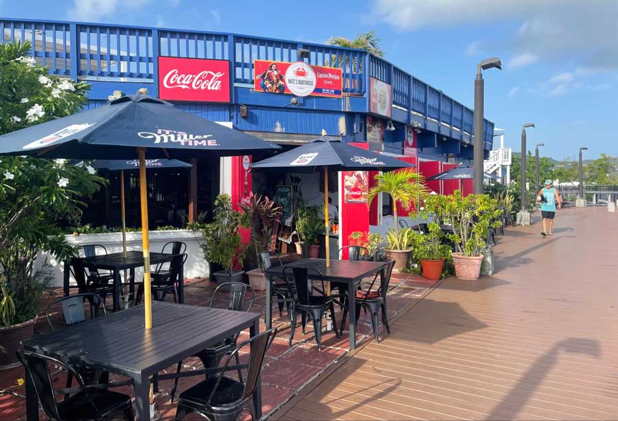 Chairs and tables outside a restaurant in Christiansted Boardwalk