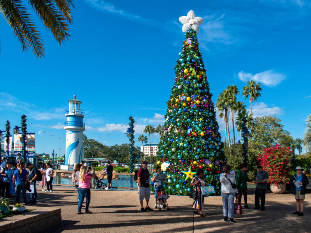 A giant Christmas tree and other decorations around at Seaworld