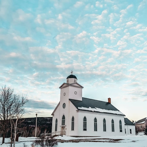 View of a church and a sky blue cloudy sky