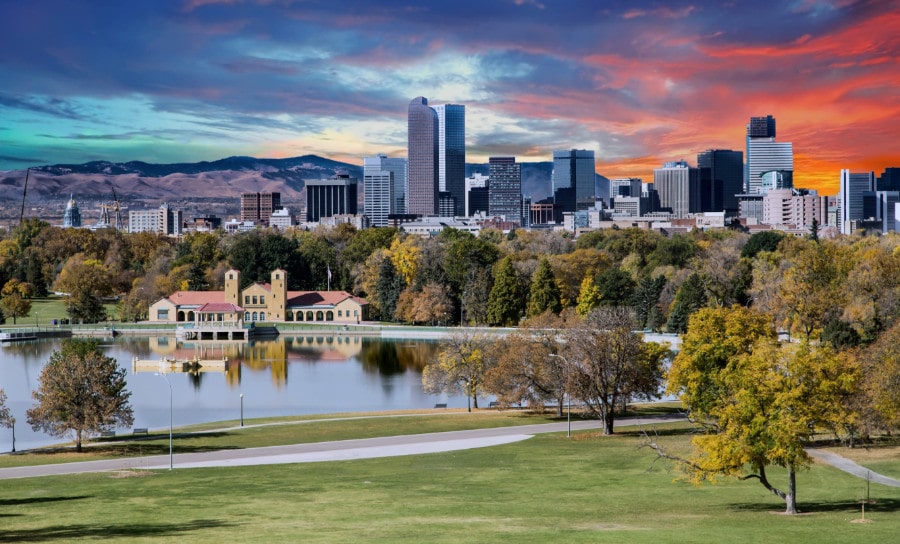 View of Denver skyline in backdrop with City Park in the foreground