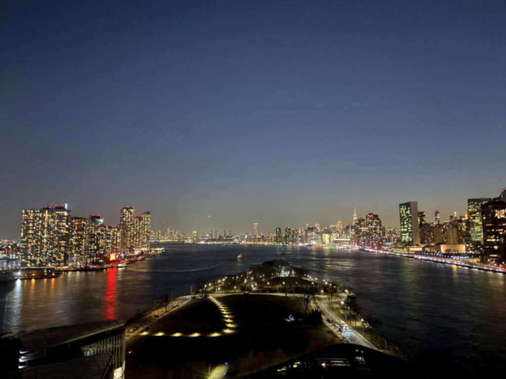 Panoramic view of Manhattan, Brooklyn, & Queens from the rooftop at night