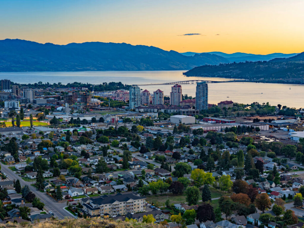 Aerial view of the city of Kelowna and the Okanagan Lake during sunset
