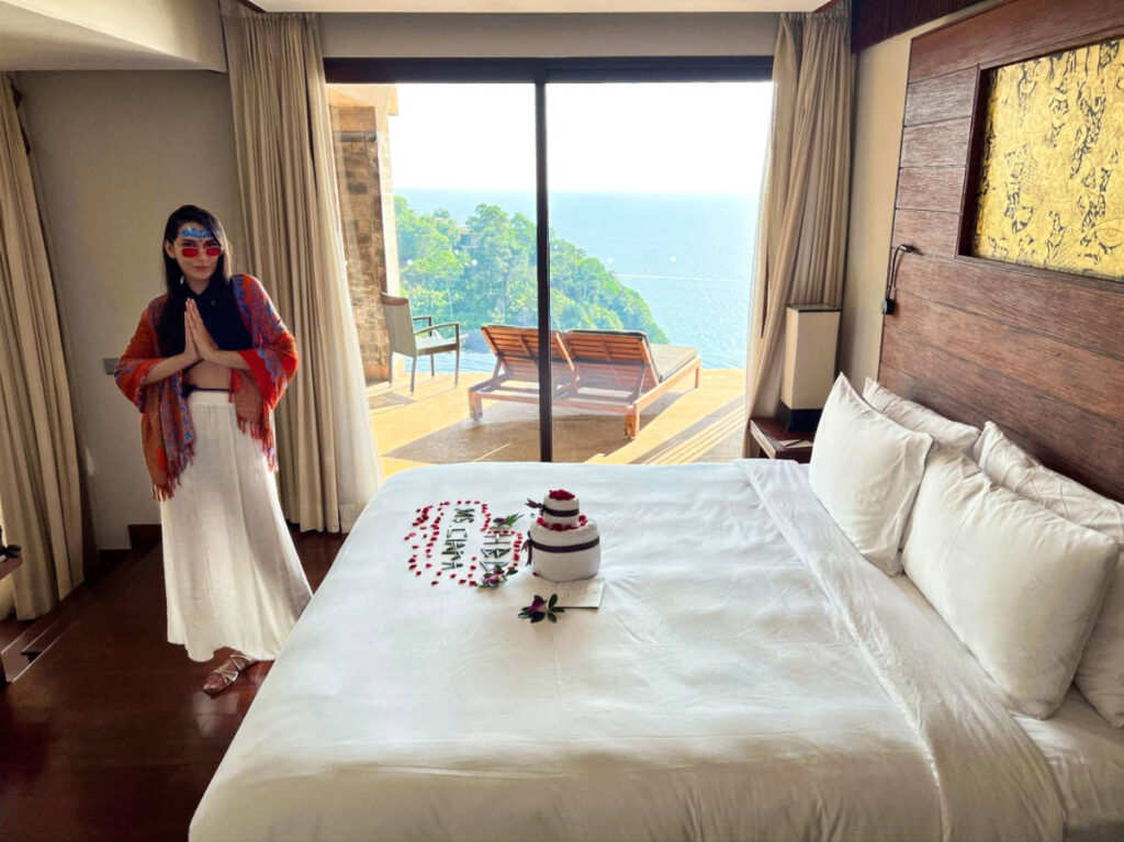 The author's partner, Clara, posing for a photo inside the room of Paresa Resort