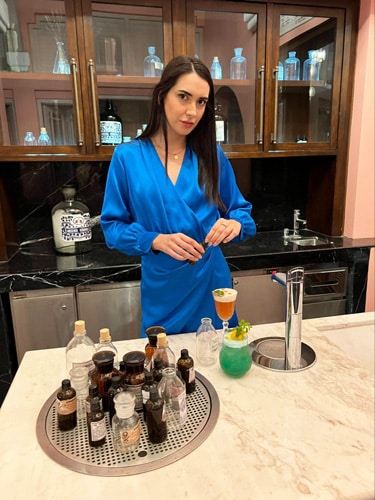 Clara mixing her on drinks in The Department of Chemistry Bar