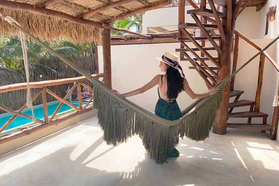 Clara on a hammock with a view from the pool in Dune Boutique Hotel