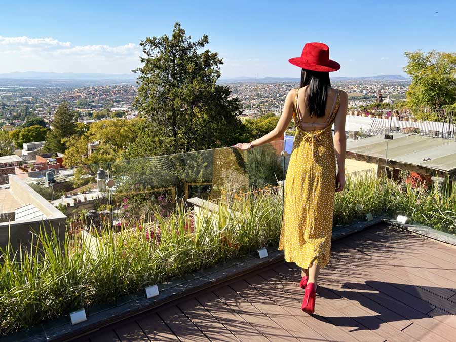 Clara in the rooftop of Hotel Mansion and the overlooking view from it