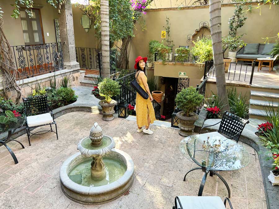 Clara posing for a picture in Hotel Mansion