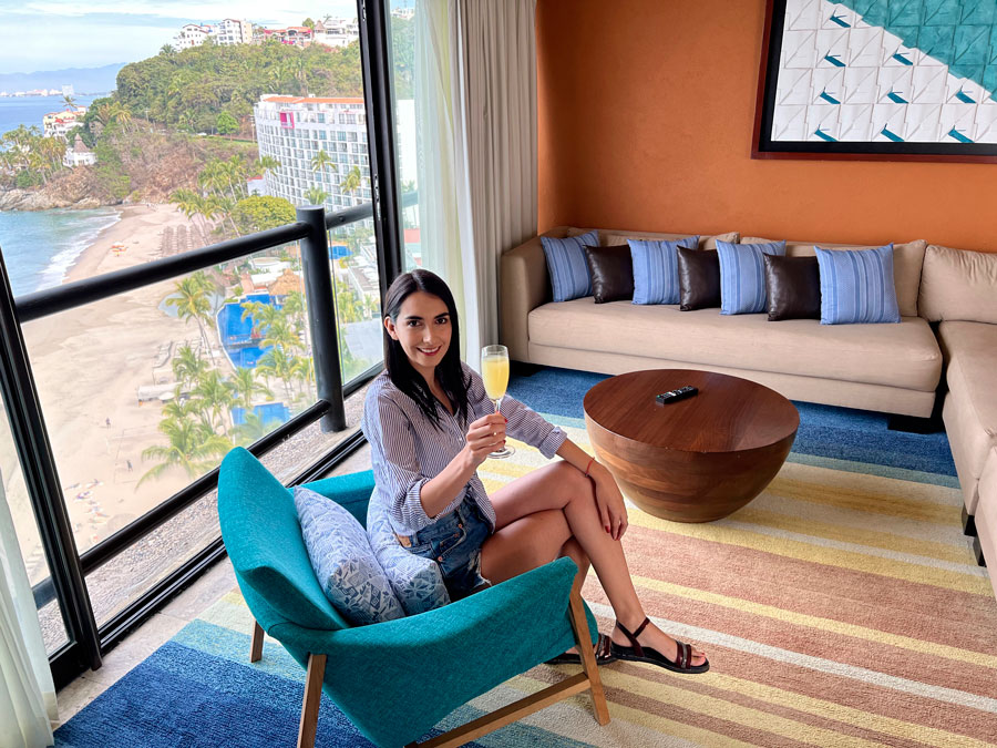 Clara sitting on a room in Hyatt Ziva with ocean view