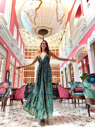 Clara posing for a photo inside the Pink Pearl