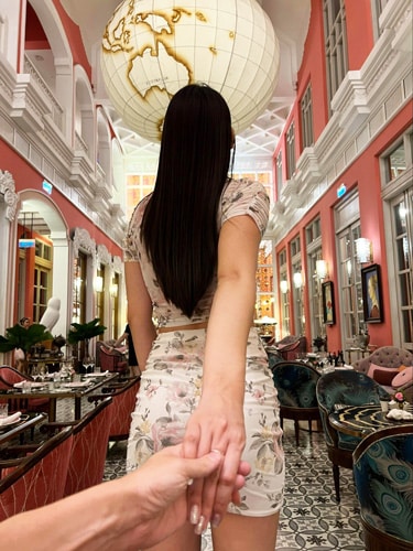Nate holding Clara's hand at the Pink Pearl