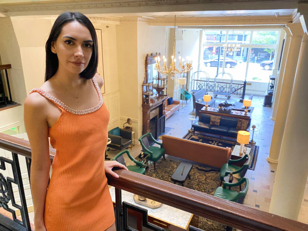Clara Kesseler with a view of the lobby in The Oxford Denver Hotel