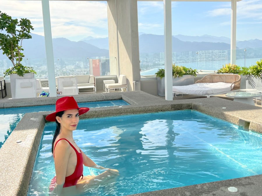 Clara posing for a picture while on pool in Hotel Mio Vallarta