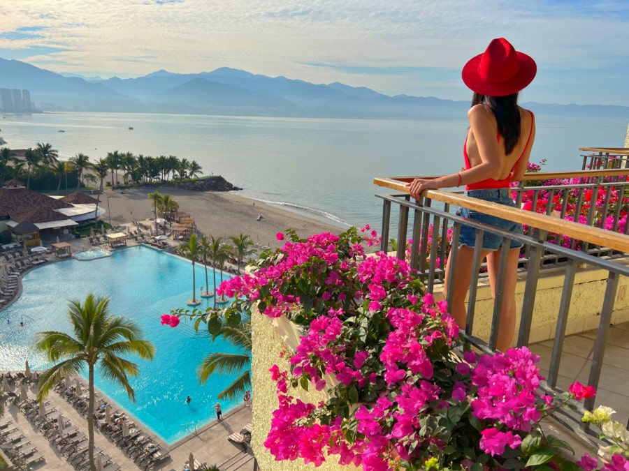 Clara admiring the view from a balcony in Marriot Resort Puerto Vallarta