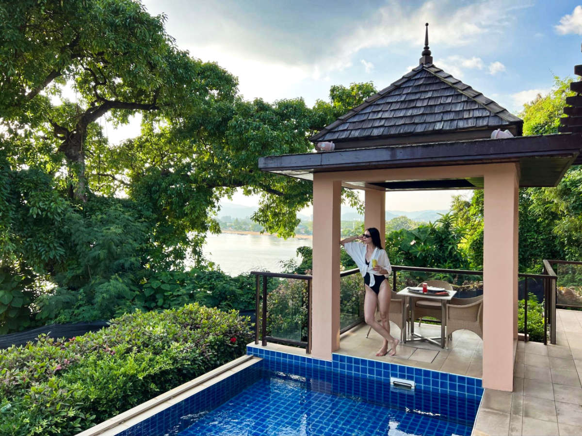 The author's partner, Clara posing for a photo at the private pool of Westin