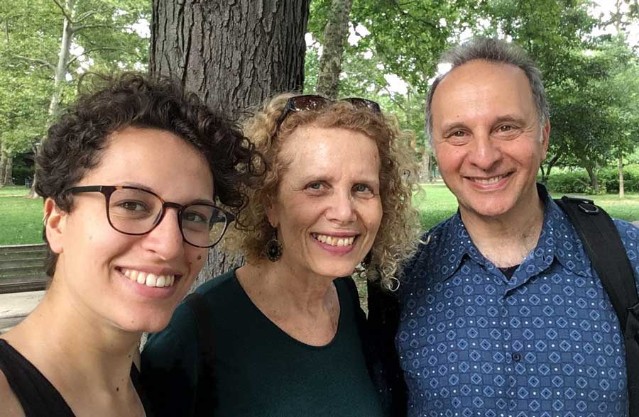 The author with her parents smiling for a photo in Clark Park