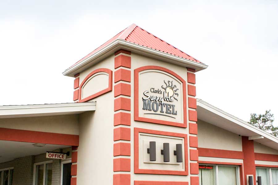 The Clark’s Sunny Isle Motel logo on the outside
