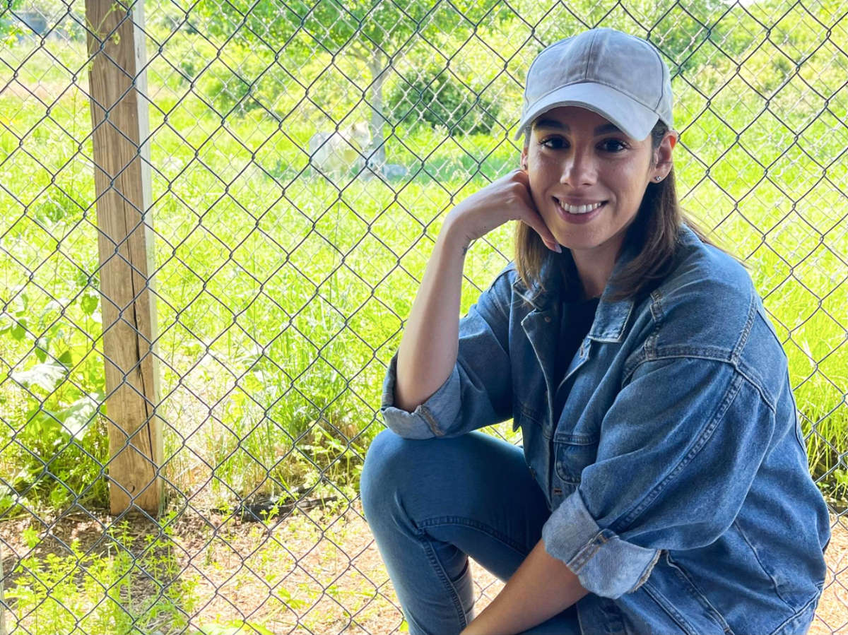 The author Claudicet Pena, posing for a photo at Wolf Hollow
