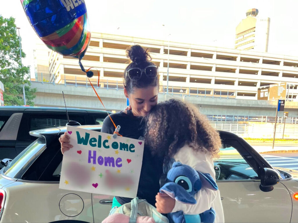 The author and her daughter reuniting at the airport