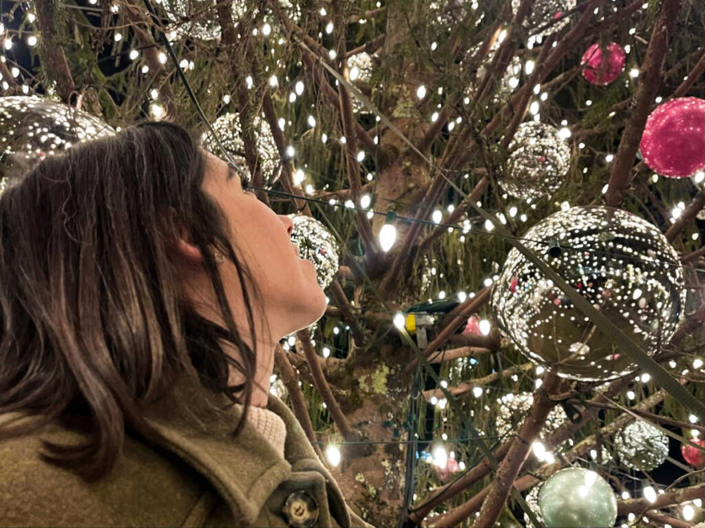 The author Claudicet Pena looking up the Christmas Tree from below