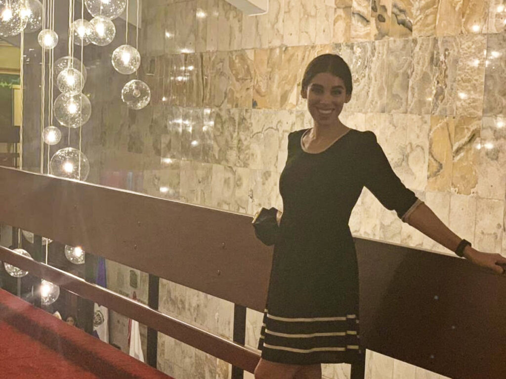The author Claudicet posing for a photo at the Teatro Nacional Eduardo Brito