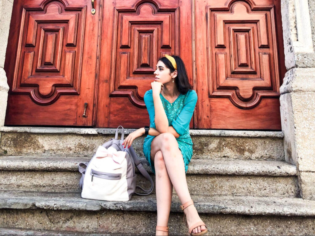 The author Claudicet posing at the staircase in Calle Las Damas