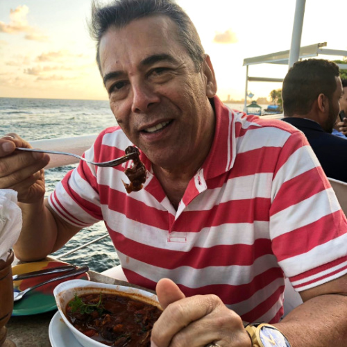 The author's father enjoying his meal at Adrian Tropical by the Malecon