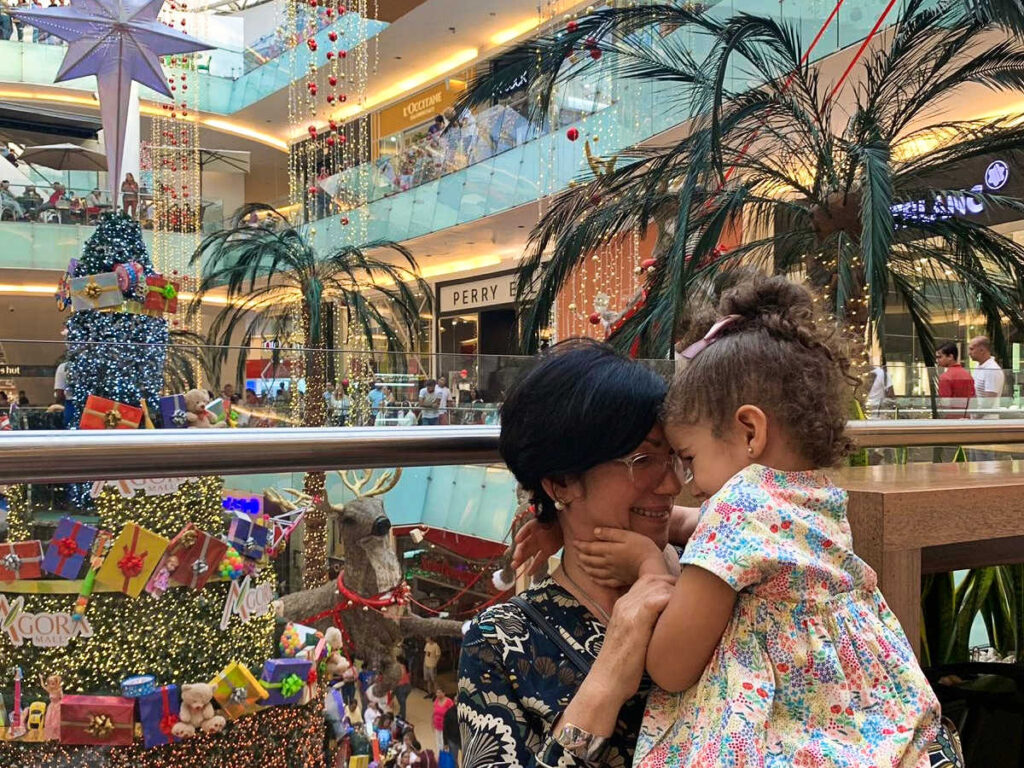 The mother and daughter of Claudicet enjoying inside the Agora Mall with Christmas decorations