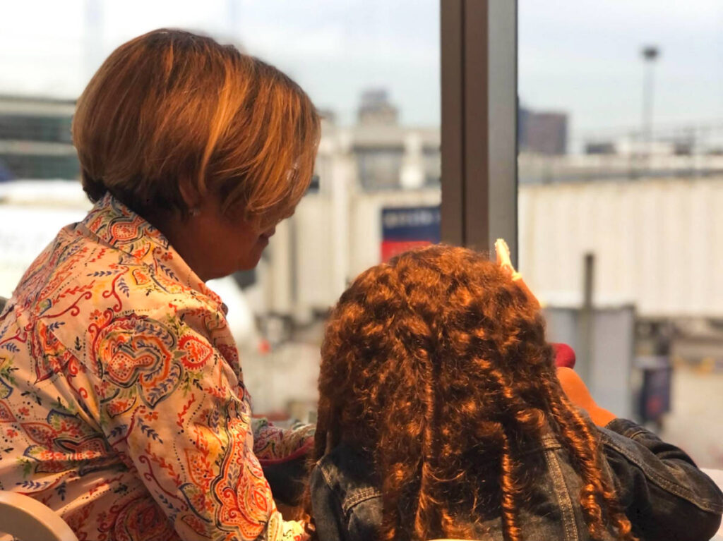 The author Claudicet Pena's mother and daughter enjoying a snack at the airport