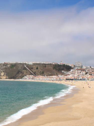 Panoramic view of the town from the shoreline of Praia da Nazaré