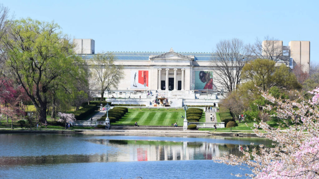Exterior view of the Cleveland Museum of Art with the lush green and springtime trees