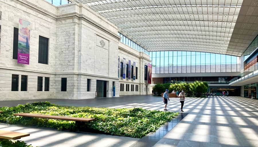Interior view of the spacious Cleveland Museum of Art with beautiful rays of light from glass windows